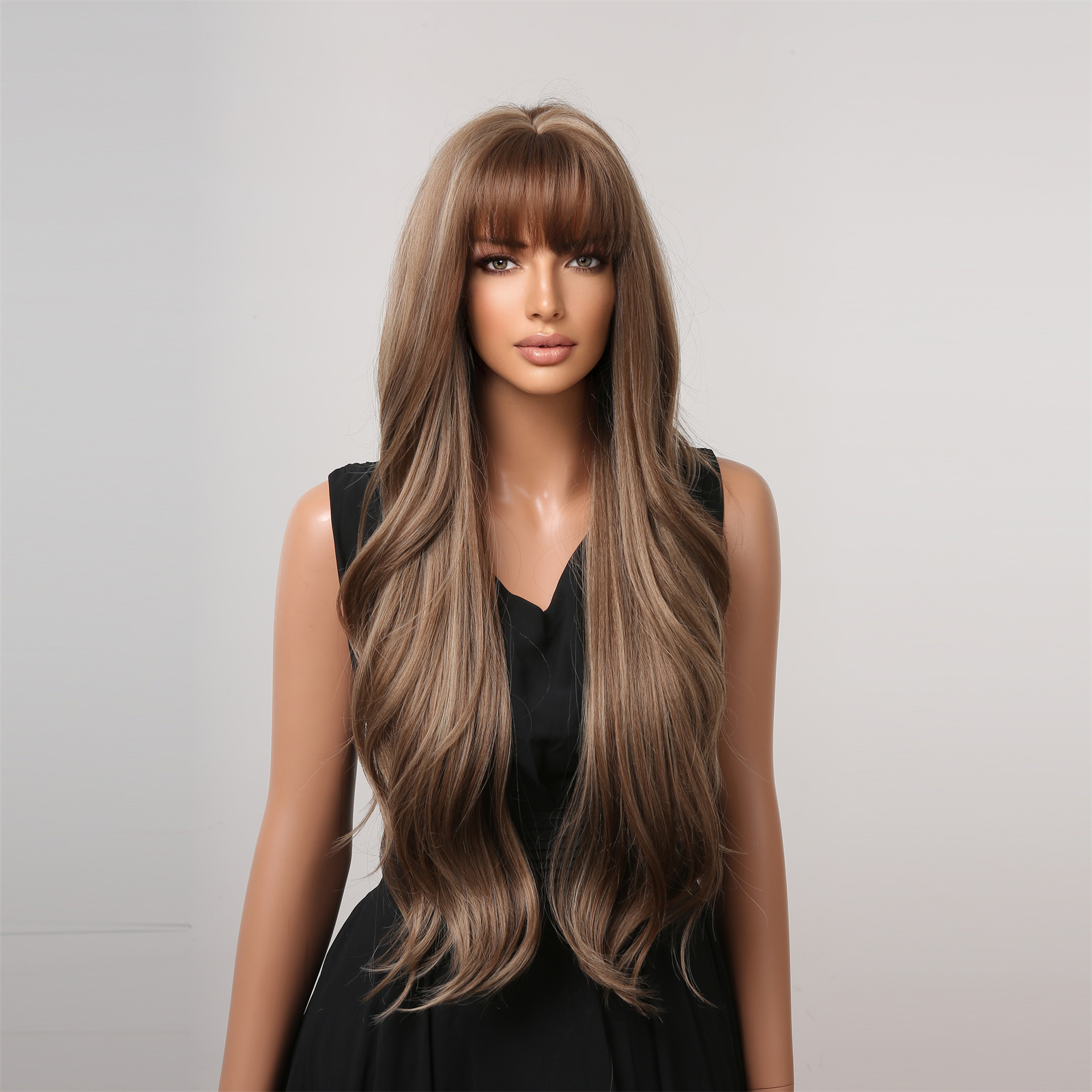 A stylish synthetic wig featuring dark brown long curly hair with bangs, designed for an effortless and fashionable look