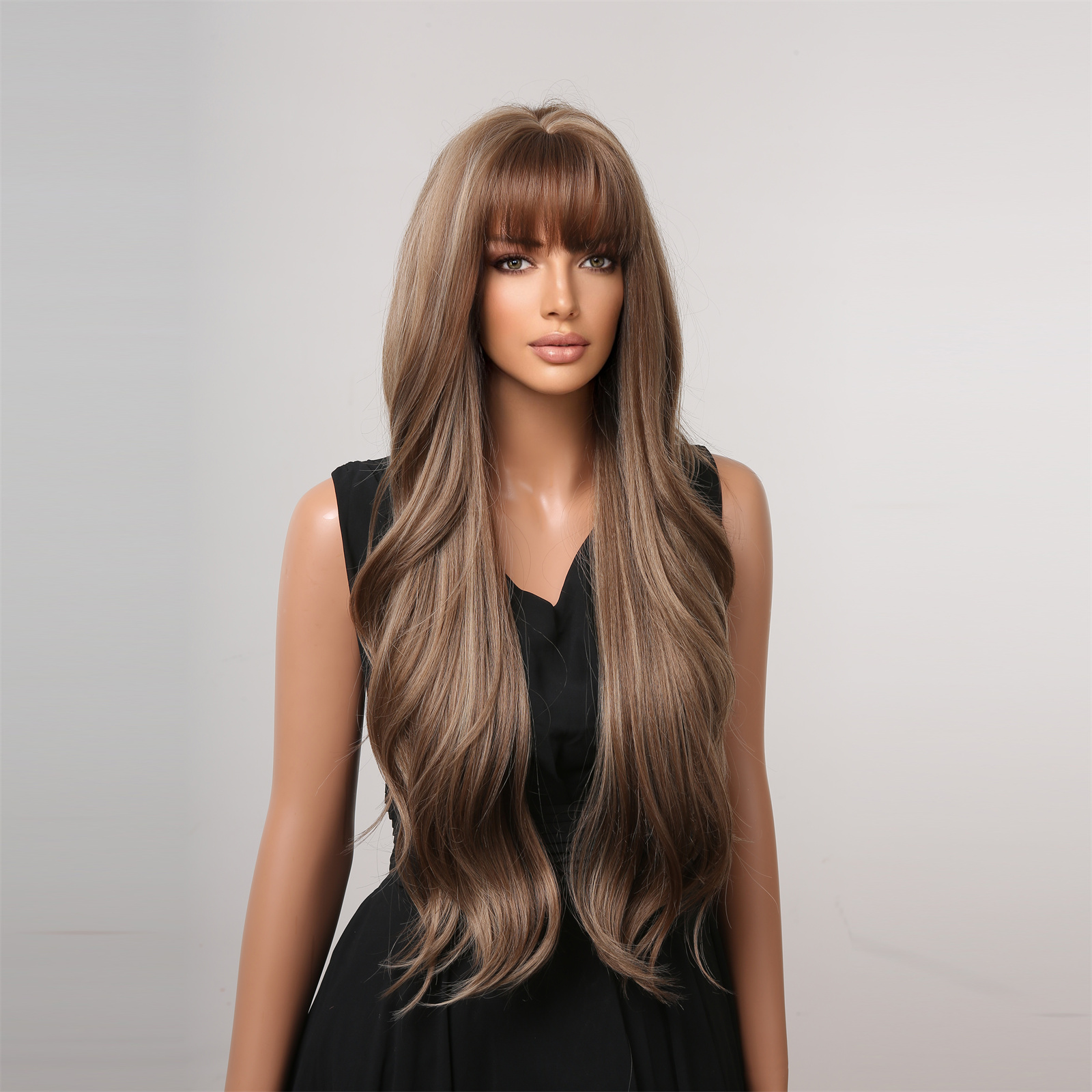 A fashionable dark brown wig with long curly hair and bangs, made from synthetic material for easy styling and a trendy appearance