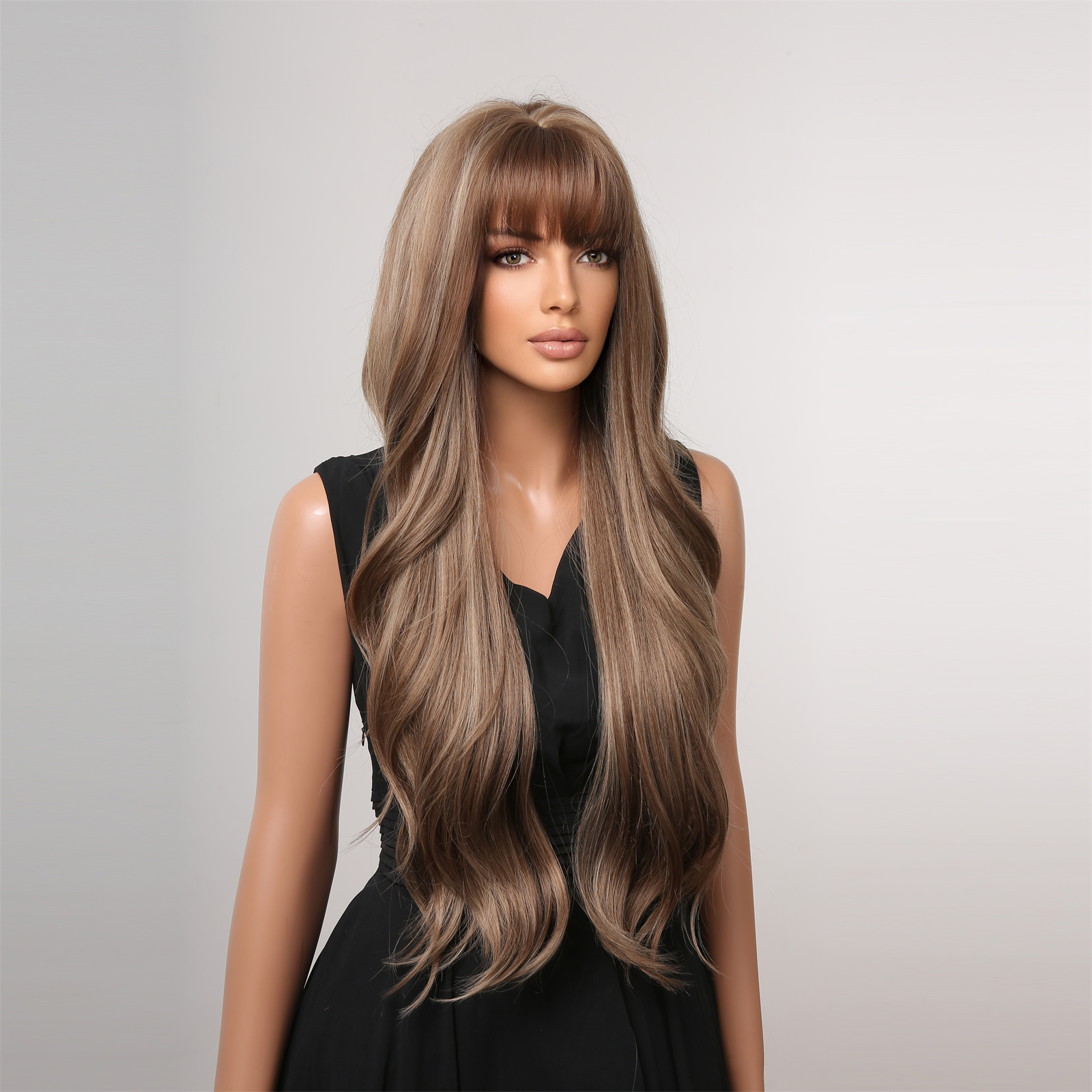 A stylish synthetic wig with dark brown long curly hair and bangs, perfect for a ready-to-go look