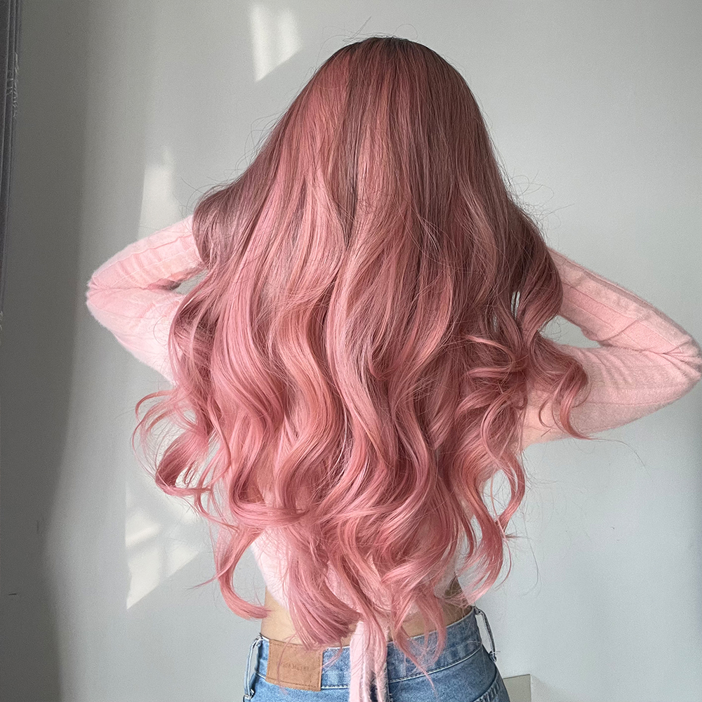 Stylish synthetic wig in fashionable pink with long curly hair, ready to wear