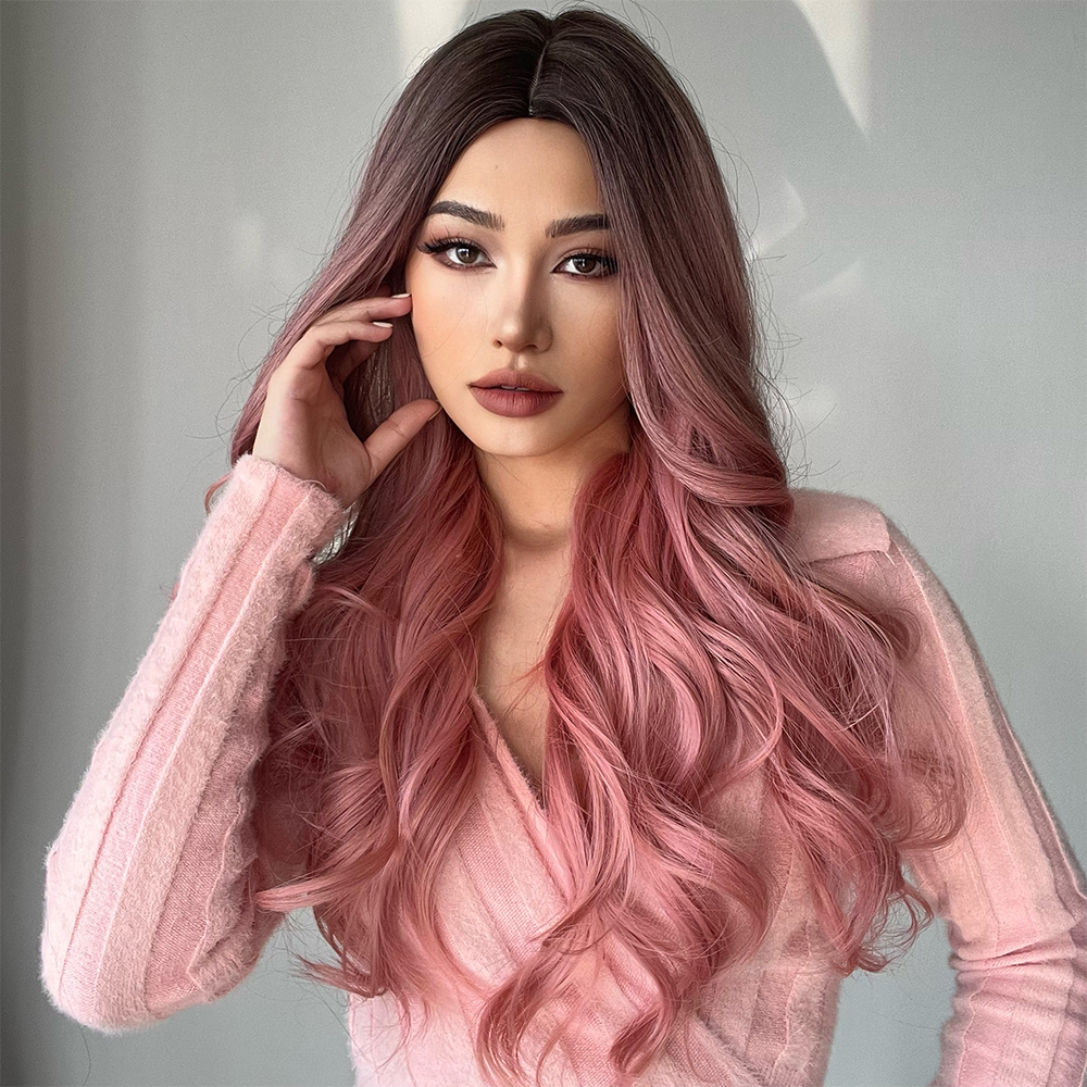 A fashionable synthetic wig in pink with long curly hair, styled and ready to go