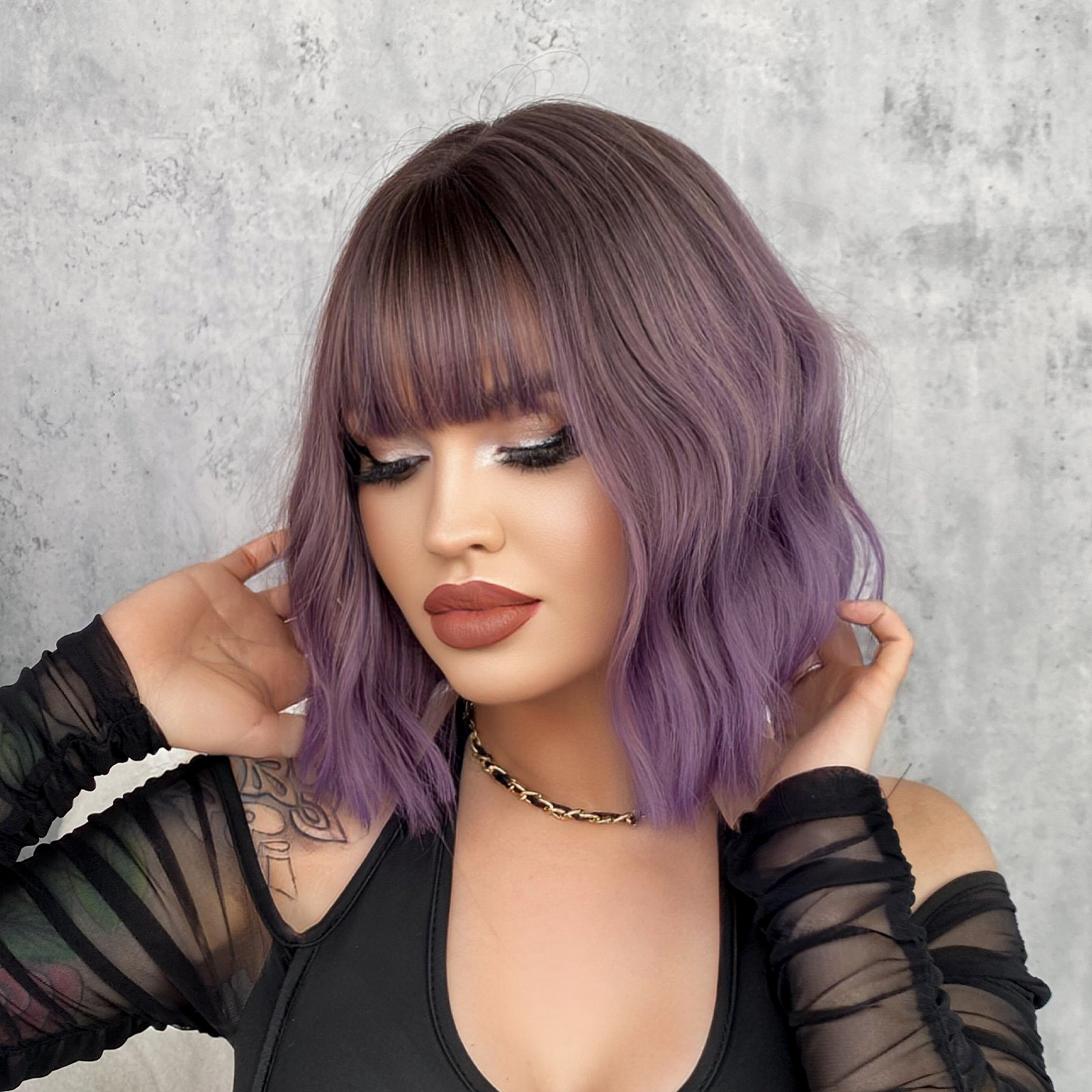 A synthetic wig in purple water ripple style with pear short curly hair and air bangs, designed for women and ready to go