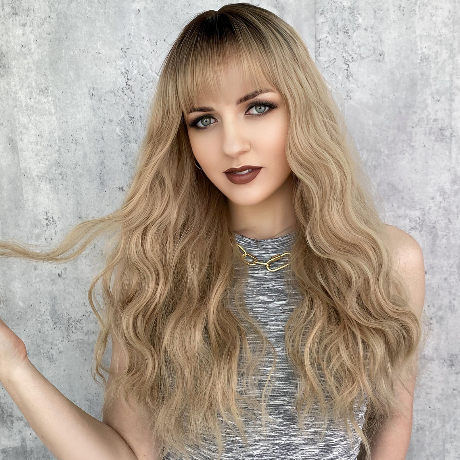 A synthetic wig designed for women's fashion, featuring long wavy blonde hair set on a rose net for easy styling