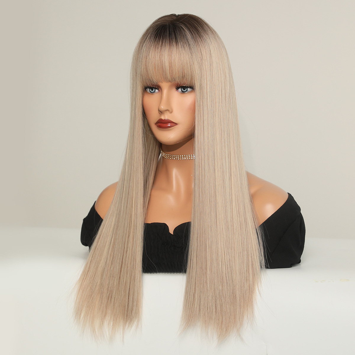A synthetic wig in champagne blonde with long straight hair, ready to go for instant wear.
