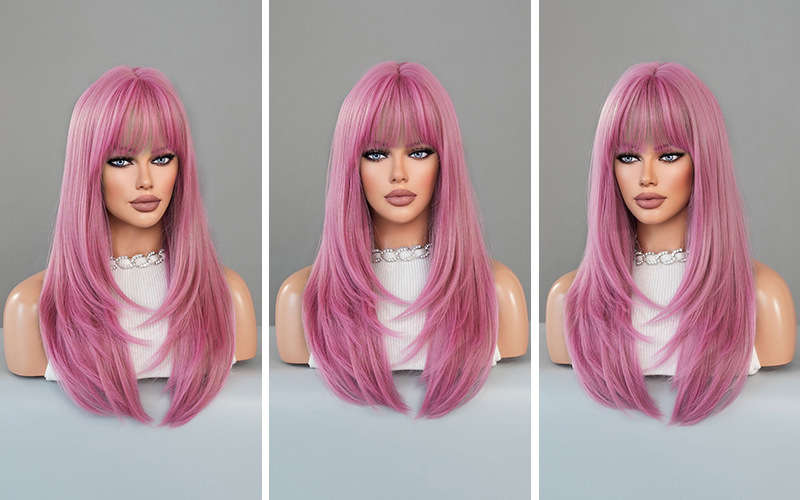 A synthetic wig in pink featuring long curly hair, ready to go for effortless style