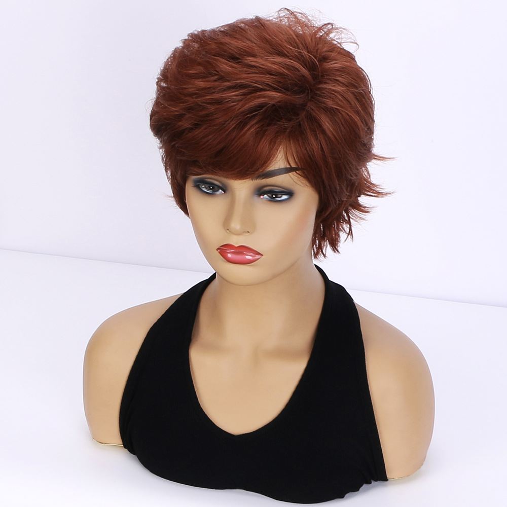 Fashionable brown synthetic wig with short fluffy curly hair and realistic diagonal bangs