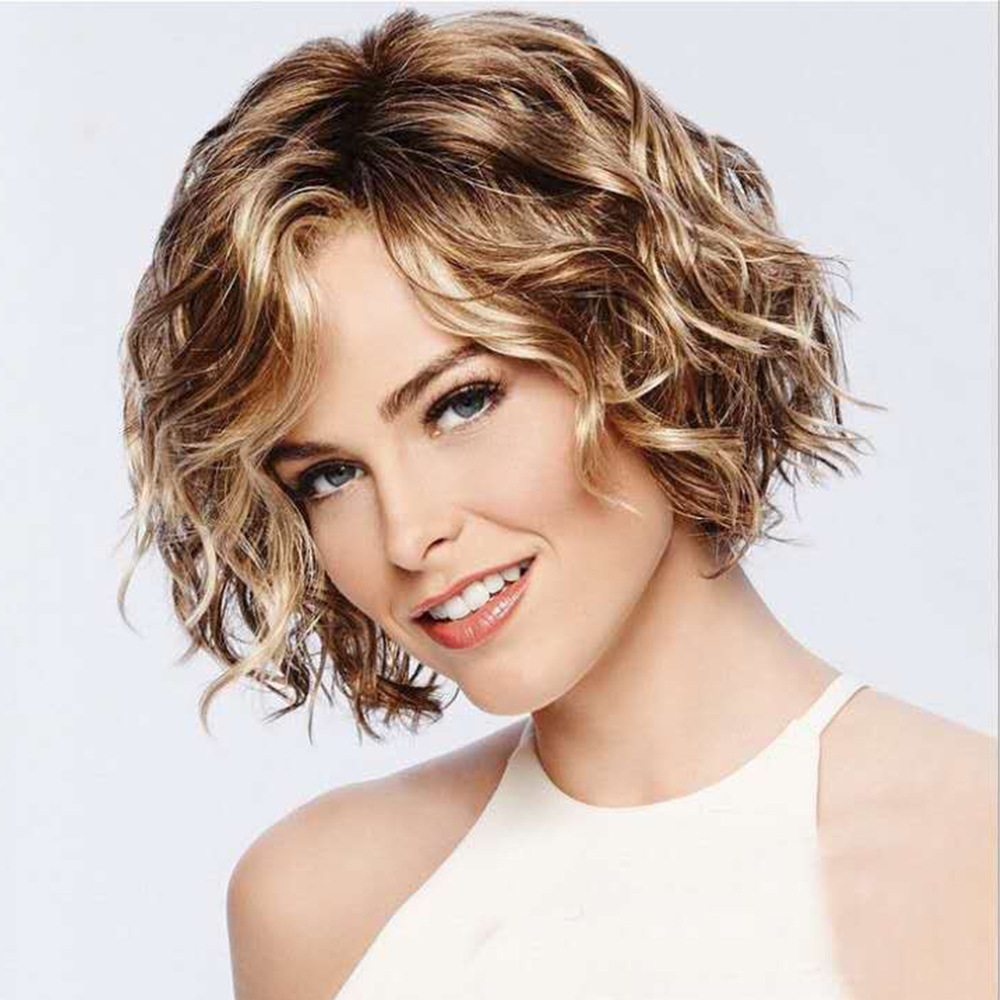 A fluffy short curly synthetic wig featuring a mix of light blonde and brown tones, styled with diagonal bangs