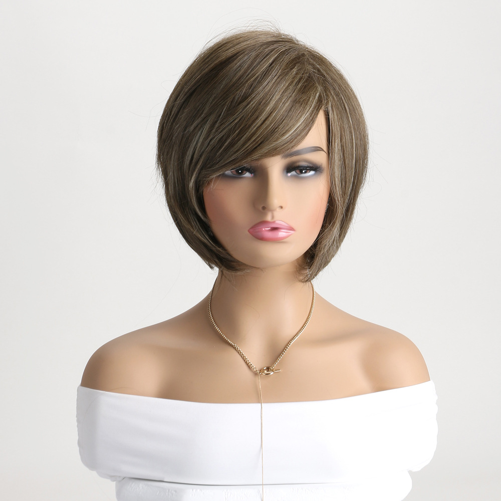 A synthetic wig featuring light brown short curly hair styled with diagonal bangs