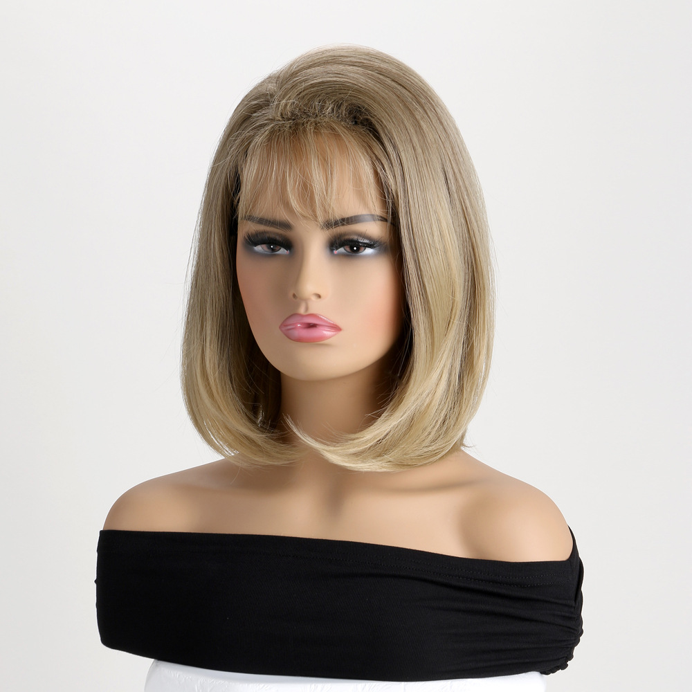A light blonde wig for women featuring short straight synthetic hair with bangs